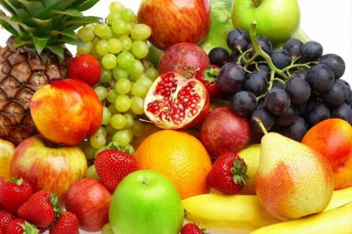 a pile of fruits and vegetables on a plate at Auberge Les Bons Matins in Montréal