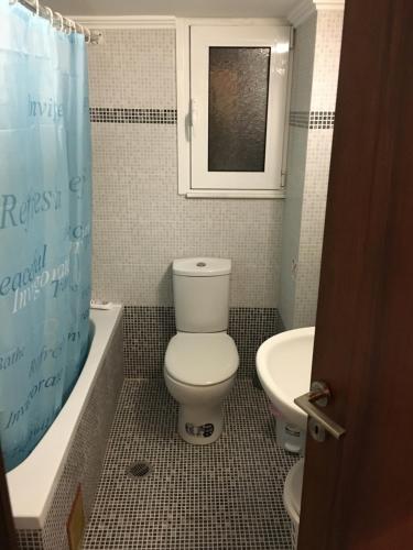 a bathroom with a toilet and a sink at Matrel Home in Rhodes Town