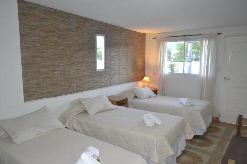 Una cama o camas en una habitación de Guest House Jujuy