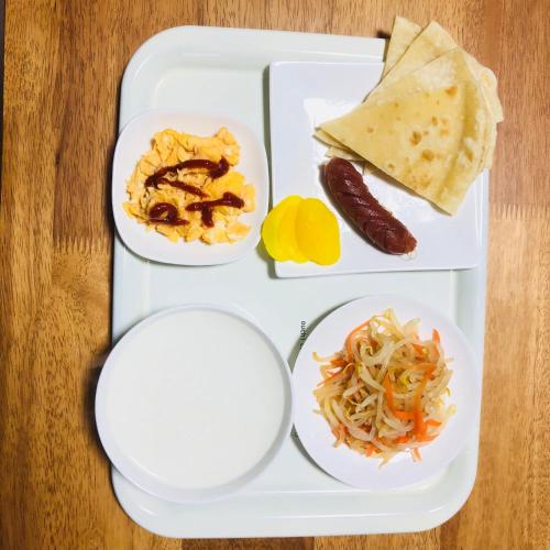a tray with three plates of food on a table at GreenHotel in Tokyo