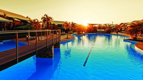 a large pool with blue water in a resort at Oaks Cable Beach Resort in Broome