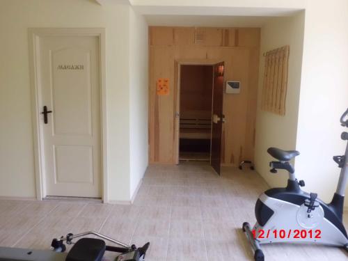 a room with a scooter parked in a room at Семеен хотел Кристал in Smolyan