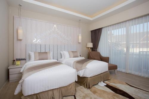 Un pat sau paturi într-o cameră la Amata Garden Resort Bagan