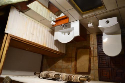 a bathroom with a toilet and a sink at Namibs Valley Lodge in Gamsberg Pass