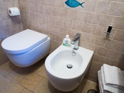 a bathroom with a toilet and a sink at Casa Almagio - Atrani Amalfi coast - terrace & seaview in Atrani