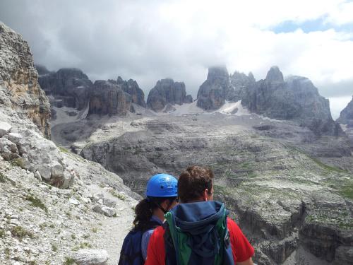 two people standing on a mountain looking at a canyon at Baita Mas Sora Sass in Rabbi