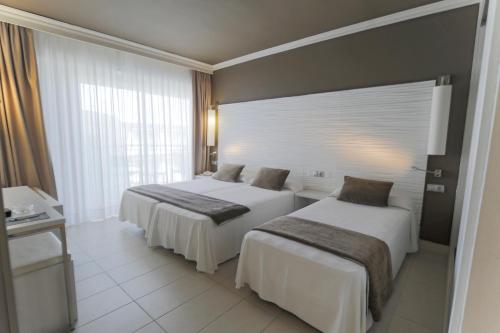 Postel nebo postele na pokoji v ubytování Hotel Augustus