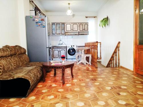 a living room with a couch and a table at Hostel Sakharov & Tours in Yerevan