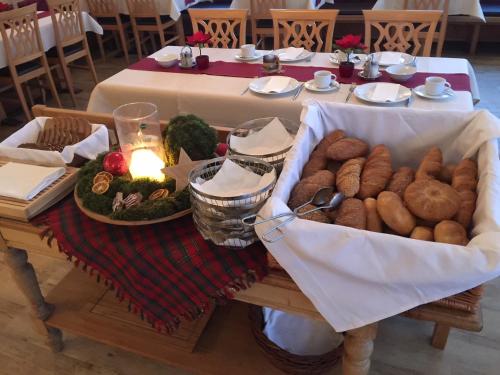 a table with a bunch of food on it at Hotel Schönberger in Nussdorf am Attersee