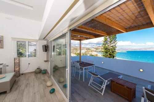 a house with a view of the ocean at Lindian Jewel Hotel and Villas in Líndos