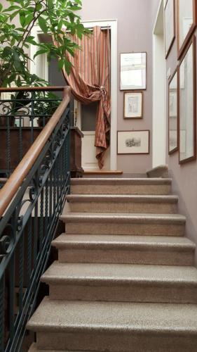 a set of stairs in a house with a curtain at Maison 26 - Luxury Suites in Ravenna