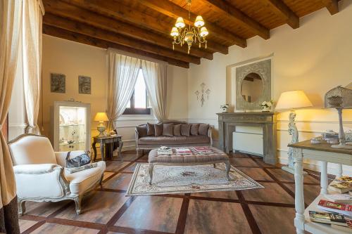a living room with a couch and a table at Hotel Villa Calandrino in Sciacca