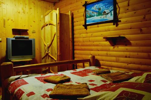 Postel nebo postele na pokoji v ubytování Zatishok Bilya Richky
