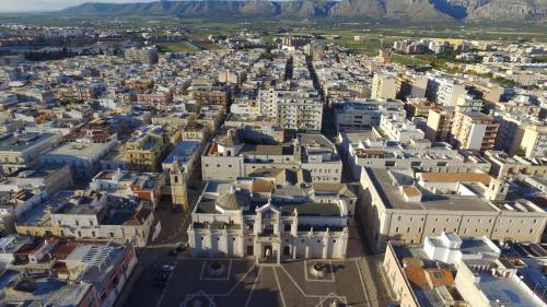 an aerial view of a city with buildings at Aduepassi apartments in Manfredonia