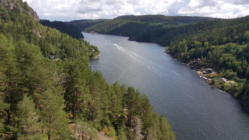an aerial view of a river with trees at Motell Svinesundparken in Halden
