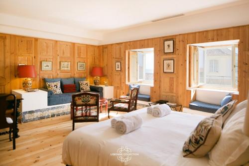 a bedroom with a bed and a living room at Alfama Unique & Romantic Studio by LovelyStay in Lisbon
