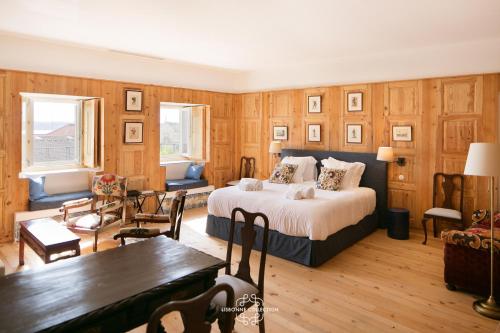 a bedroom with a bed and a dining room at Alfama Unique & Romantic Studio by LovelyStay in Lisbon