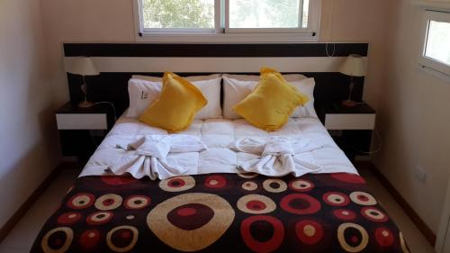 Una cama o camas en una habitación de Complejo Pampa