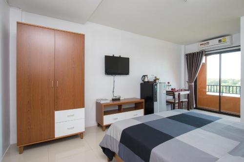 Postel nebo postele na pokoji v ubytování I-Home Residence and Hotel