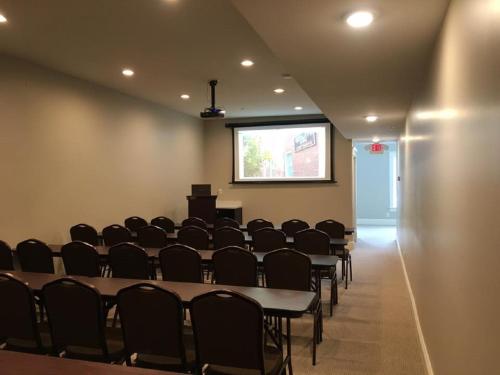 a conference room with tables and chairs and a podium at Talbott Tavern and Inn in Bardstown