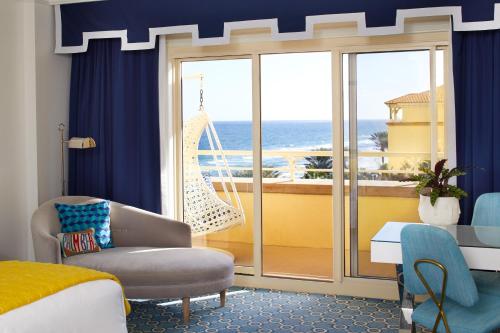 a hotel room with a view of the ocean at Eau Palm Beach Resort & Spa in Palm Beach