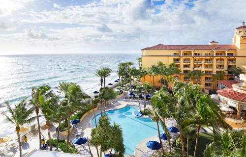 an aerial view of the resort and the ocean at Eau Palm Beach Resort & Spa in Palm Beach