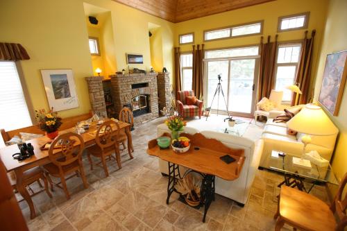 a living room with a couch and a table at Buffaloberry Bed & Breakfast in Banff