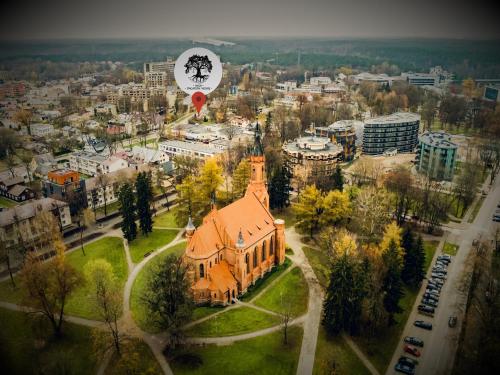 an aerial view of a city with a church at Inga Vacation House in Druskininkai