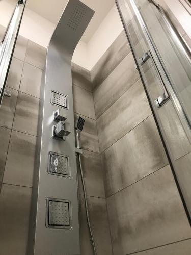 a metal shower stall in a subway train at Loft Sirmione in Sirmione