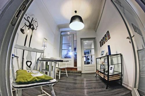a room with a mirror and a table and a desk at My Hostel in Guimarães