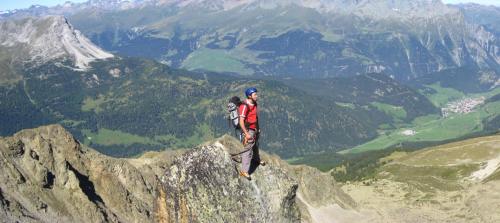 a man standing on the edge of a mountain at Haus Brigitte in Nauders