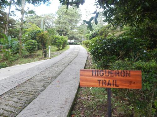 a sign on the side of a road that reads high iron trail at Coffee Estate Inn in Boquete