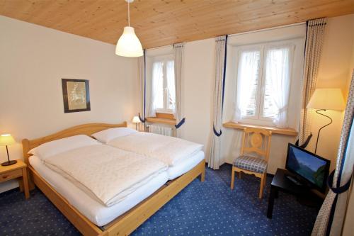 Postel nebo postele na pokoji v ubytování Hôtel du Cerf