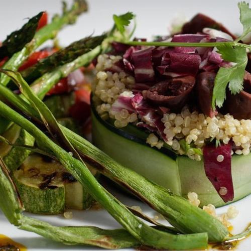 a plate of food with asparagus and other vegetables at Casa Tsaya Hotel Boutique in Bernal