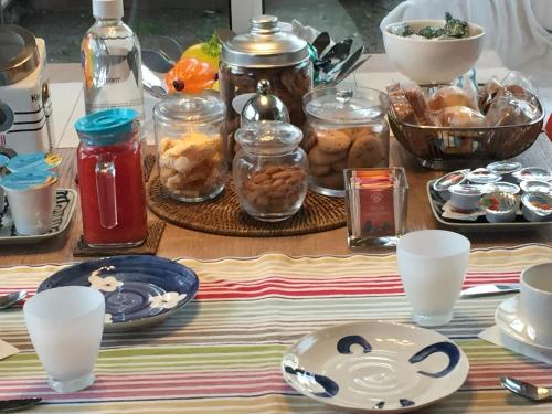 a table topped with plates of food and drinks at La Mansarda di Margherita in Treviso