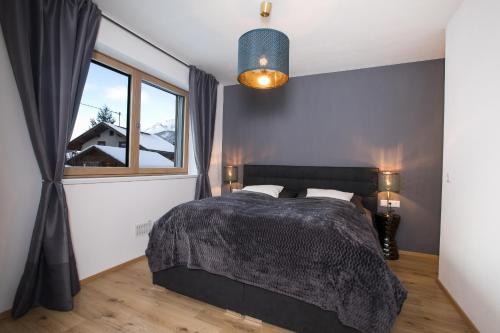 Posteľ alebo postele v izbe v ubytovaní alpennest stubai