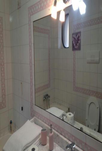 a bathroom with a sink and a mirror at Il sorriso in Salerno