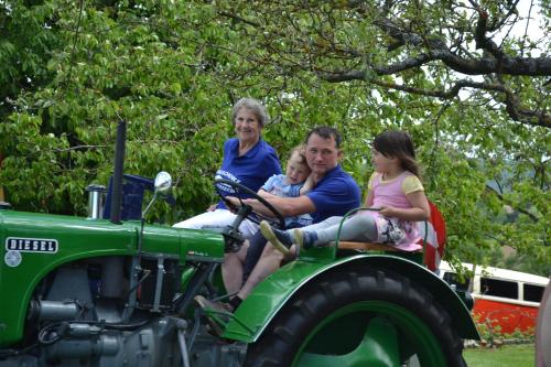 a family riding on the back of a tractor at Ferienwohnung Gerersdorf in Gerersdorf bei Güssing