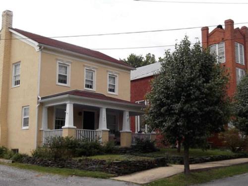 a large house with a tree in front of it at Schilling House in Harpers Ferry