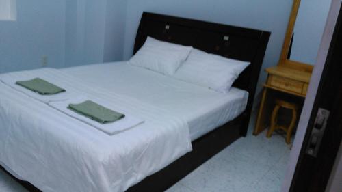 VKS Family Surfer House tesisinde bir odada yatak veya yataklar