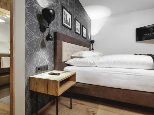 Ένα ή περισσότερα κρεβάτια σε δωμάτιο στο Valentin Design Apartments