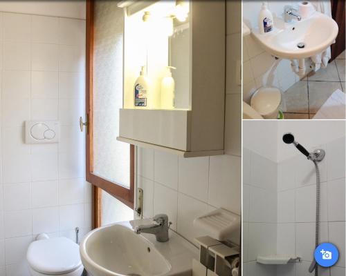 アレンツァーノにあるLocanda Vittoriaのバスルーム(洗面台、トイレ、鏡付)