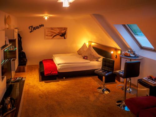 En eller flere senge i et værelse på Gästezimmer Im Haus Am Wald