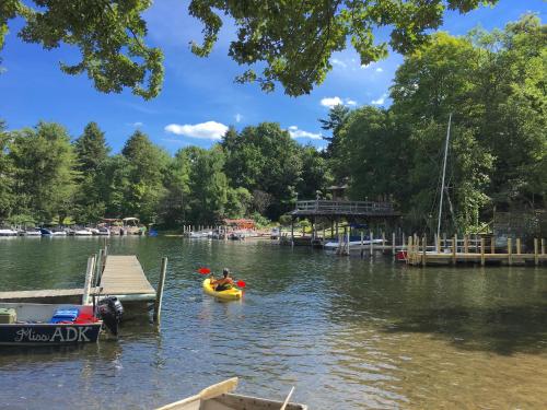 a couple of people in a kayak on a lake at The Villas on Lake George in Diamond Point