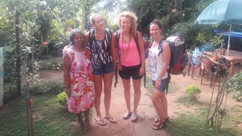 a group of three women posing for a picture at Moon Light Rest in Galle