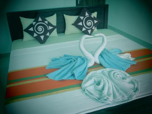 Postel nebo postele na pokoji v ubytování Hotel Kiyara