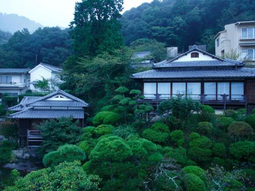 an asian village with houses and trees at Kotohira Kadan in Kotohira