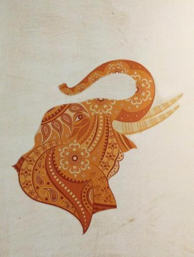a drawing of a leaf on a wall at Hotel Rangoli in Jaipur