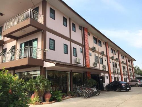 a large building with bikes parked in front of it at The Star Hotel in Udon Thani