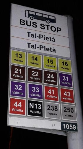 a bus stop sign at a bus stop at Giorgia House in Pieta